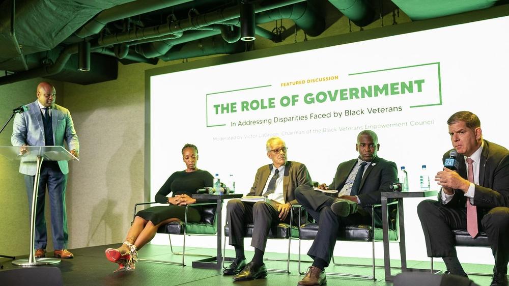 Victor LaGroon, left, chairman of the Black Veterans Empowerment Council, moderates a panel discussion with U.S. Labor Secretary Marty Walsh, right, last week in Washington, D.C.