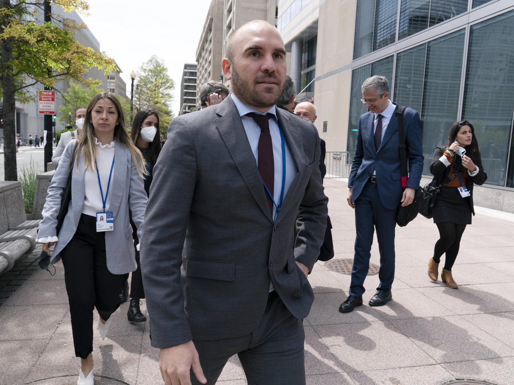 FILE - Argentina's Economy Minister Martin Guzman walks outside of the International Monetary Fund, IMF, building during the IMF Spring Meetings, in Washington, April 21, 2022. Guzman announced his resignation on Saturday, July 2, via twitter.