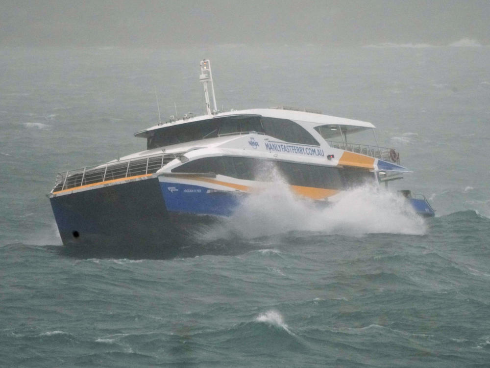 The Manly Ferry makes its way through heavy swells across Sydney Harbour, Australia, Sunday, July 3, 2022.