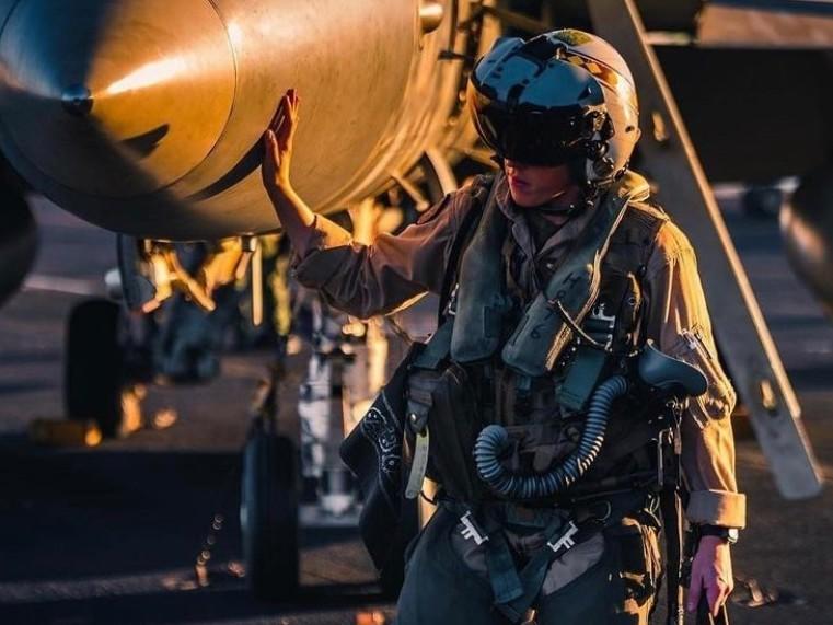 Marine Capt. Meleah Martin performing preflight inspections on her F-18 aircraft. Martin is concerned not just about her right to get an abortion, but the threat of not being able to marry the woman she loves one day.