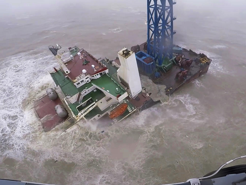 In this image released by the Hong Kong government, a helicopter with rescue crew members approaches a sinking ship in the South China Sea, 186 miles south of Hong Kong on July 2, 2022.