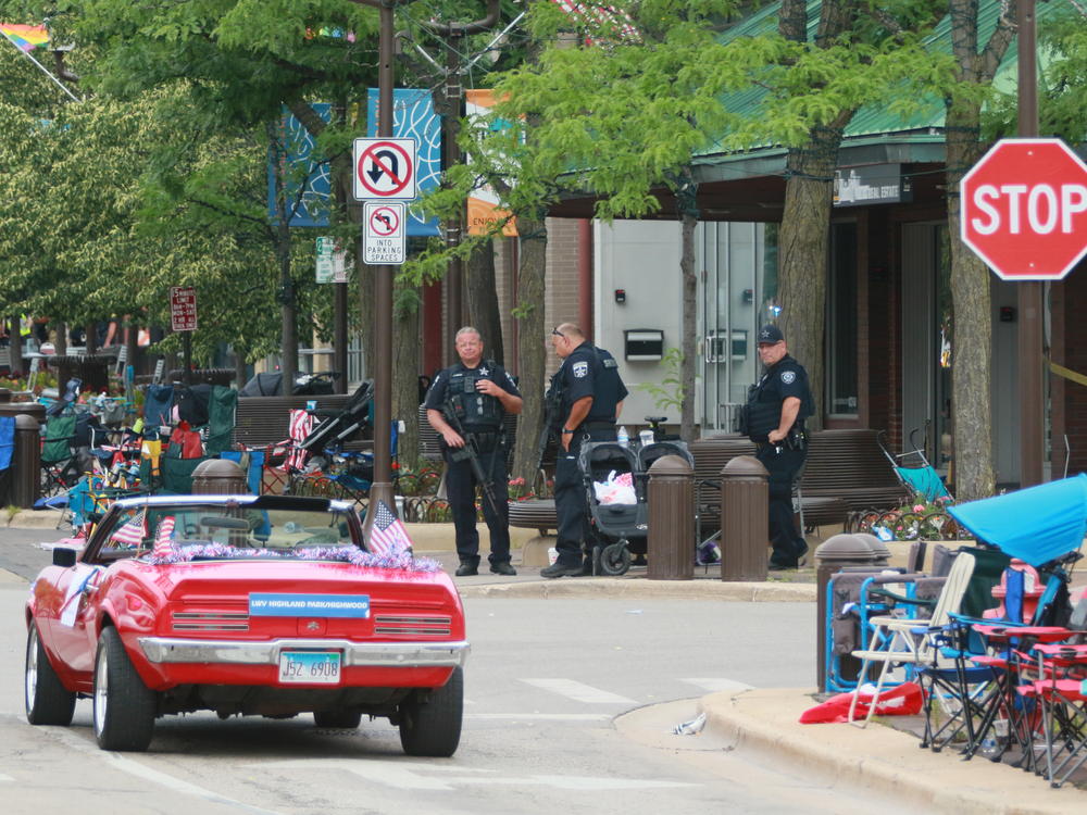 Belongings were left behind at the scene of a mass shooting along the route of a parade in Highland Park, Ill., on Monday.