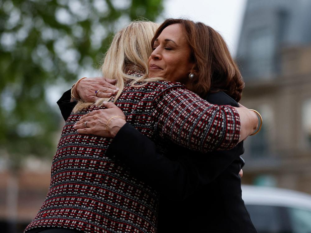 Vice President Kamala Harris hugs Highland Park, Ill., Mayor Nancy Rotering on Tuesday as she visits the site of Monday's mass shooting that killed seven people and injured dozens.
