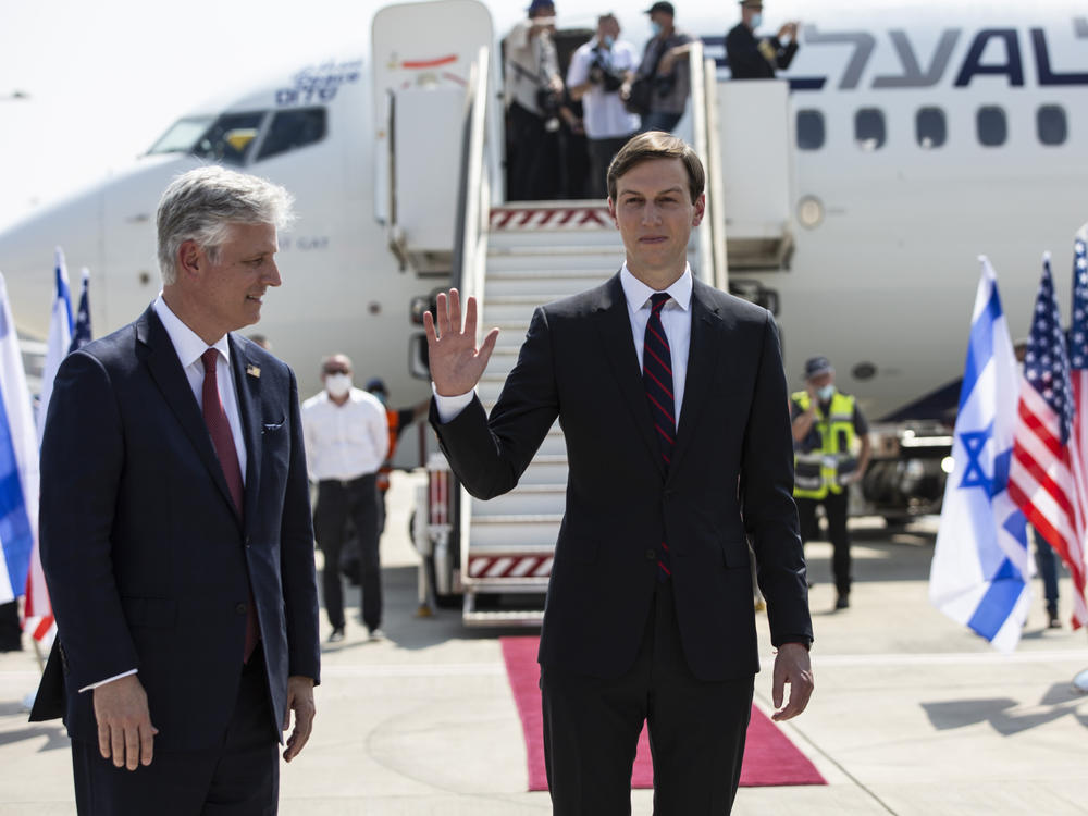 In this 2020 file photo, Jared Kushner waves as former President Donald Trump's national security adviser Robert O'Brien looks on, before their departure to Abu Dhabi from Tel Aviv.