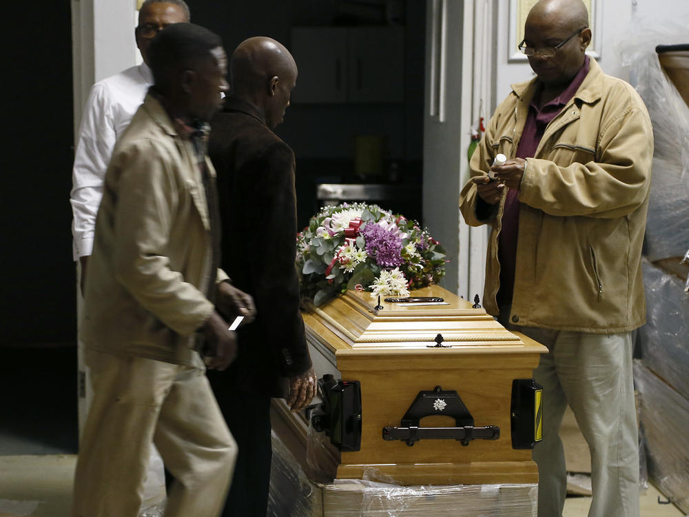 A coffin is prepared to be taken to a symbolic funeral in Scenery Park, East London South Africa, Wednesday, July 6, 2022.