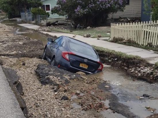 Kristin Groener's downstairs neighbor escaped his flooding apartment without his car keys, which meant he wasn't able to move his vehicle before the street sank.