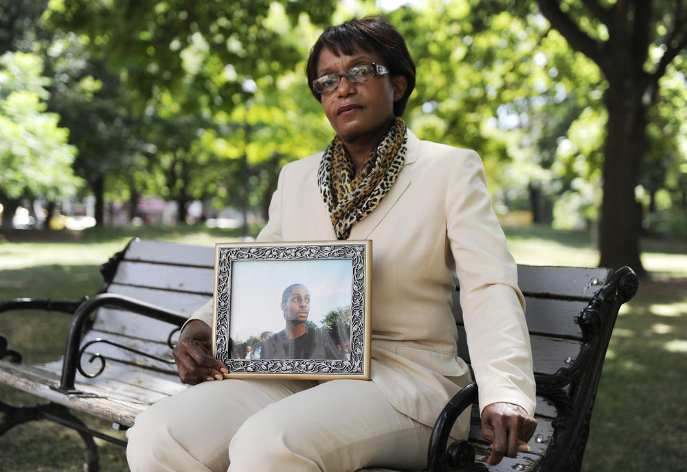 Audette Shephard holds a photo of her son Justin, who was fatally shot in 2001 at the age of 19.
