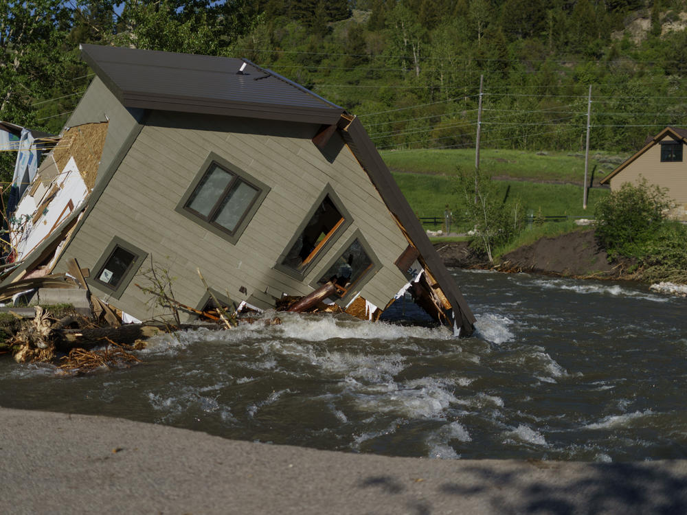 A house sits in Rock Creek on June 15 after floodwaters washed away a road and a bridge in Red Lodge, Mont.