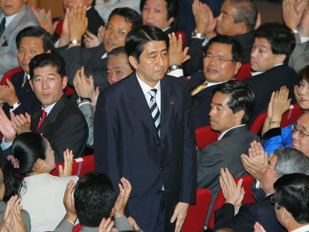 Shinzo Abe acknowledges applause from Liberal Democratic Party lawmakers as he wins Japan's ruling party's presidential vote, Sept. 20, 2006, in Tokyo.