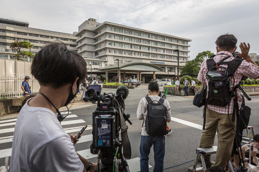 Members of the media gather in front of the Nara Medical University Hospital where Shinzo Abe was taken after being shot while speaking at a political event on Friday in Nara, a city in western Japan.