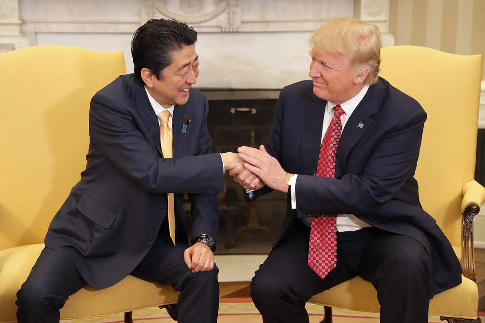 President Donald Trump and Prime Minister Shinzo Abe pose for photographs before bilateral meetings in the Oval Office at the White House, Feb. 10, 2017, in Washington, D.C.
