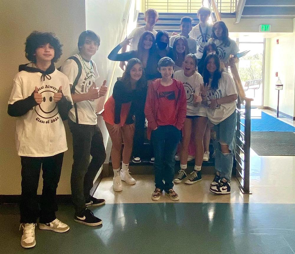 Students posing with Brody Ridder at his school.