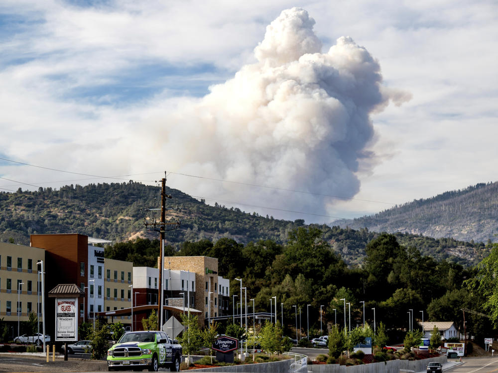 Viewed from Oakhurst in Madera County, Calif., a plume rises from the Washburn Fire burning in Yosemite National Park on Friday.