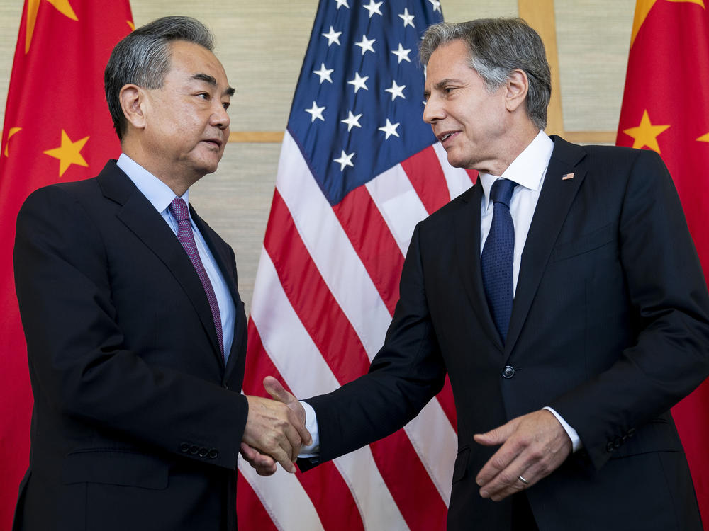 U.S. Secretary of State Antony Blinken (right) shakes hands with China's Foreign Minister Wang Yi during a meeting in Nusa Dua on the Indonesian resort island of Bali on Saturday.