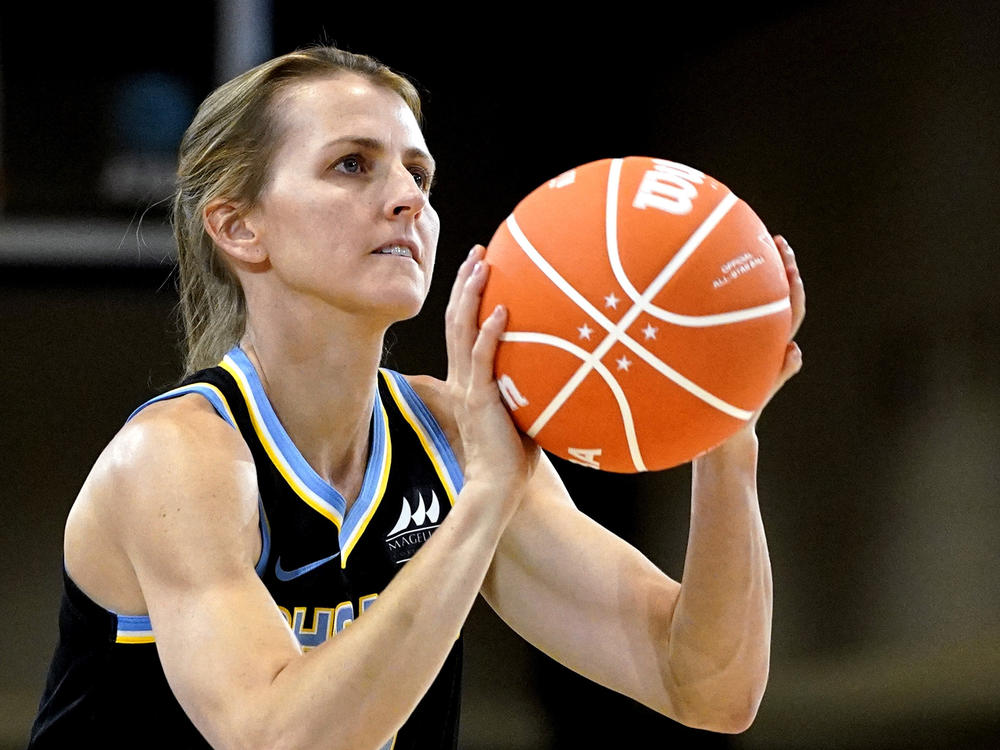 Allie Quigley competes in the 3-Point Contest at the WNBA All-Star basketball game in Chicago on Saturday. She won her fourth title — the most for any player in either the NBA or the WNBA.