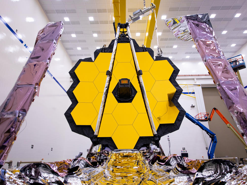 The James Webb Space Telescope (shown here being tested on earth) is expected to reveal some of the most spectacular views of the Universe ever seen.