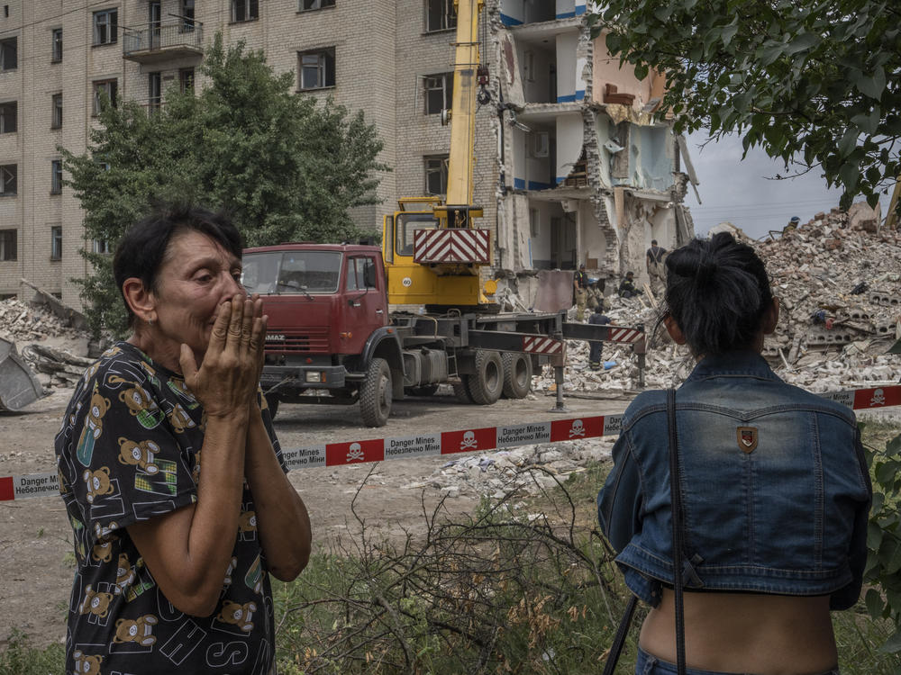 Iryna Shulimova, 59, weeps at the scene in the aftermath of a Russian rocket that hit an apartment building in Chasiv Yar, Donetsk region, eastern Ukraine, on Sunday. At least 24 people were killed and others may still be trapped in the rubble.