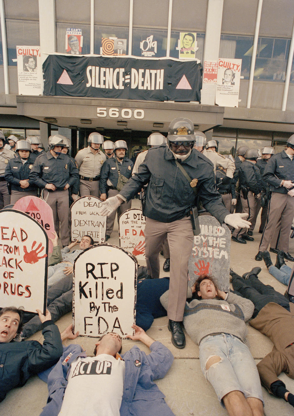 Demonstrators from the organization ACT UP, angry with the federal government's response to the AIDS crisis, protest in front of the headquarters of the Food and Drug Administration in Rockville, Md., Oct. 11, 1988, and effectively shut it down.