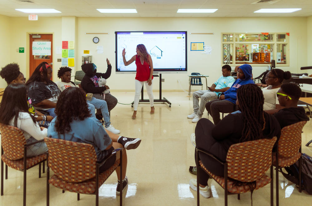 Walls speaks to members of the grief support group, Steve's Club. She openly shares her own experiences with grief with her students. 
