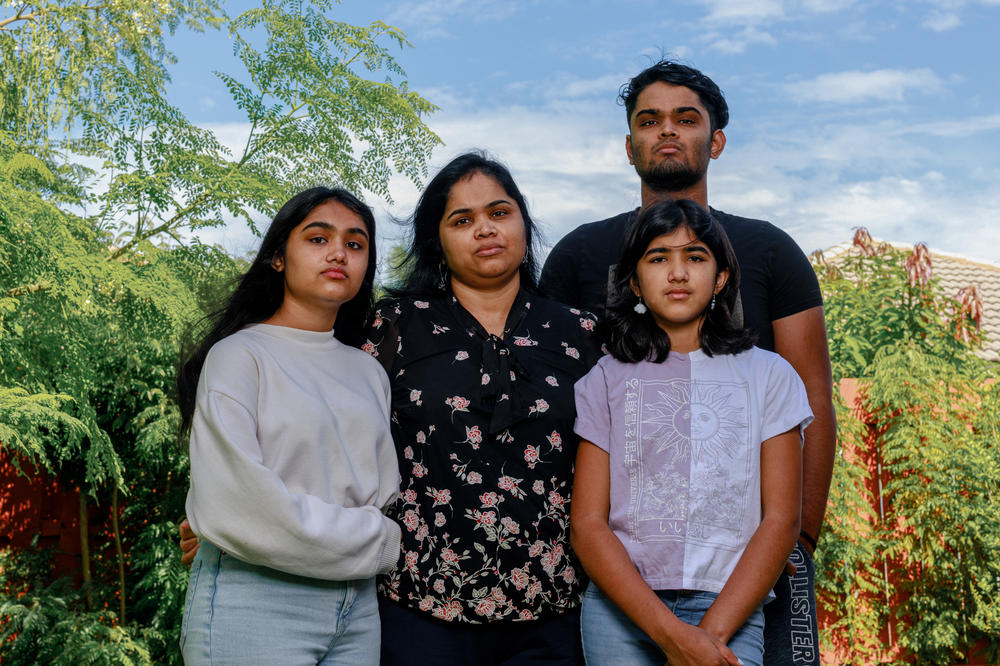 Elizabeth, left, poses for a family photo with her mother Shibi, center, and siblings Shaun and Teresa. All her children have struggled in different ways since their father's death, says Shibi, and schools should provide more mental health support for students who are grieving.