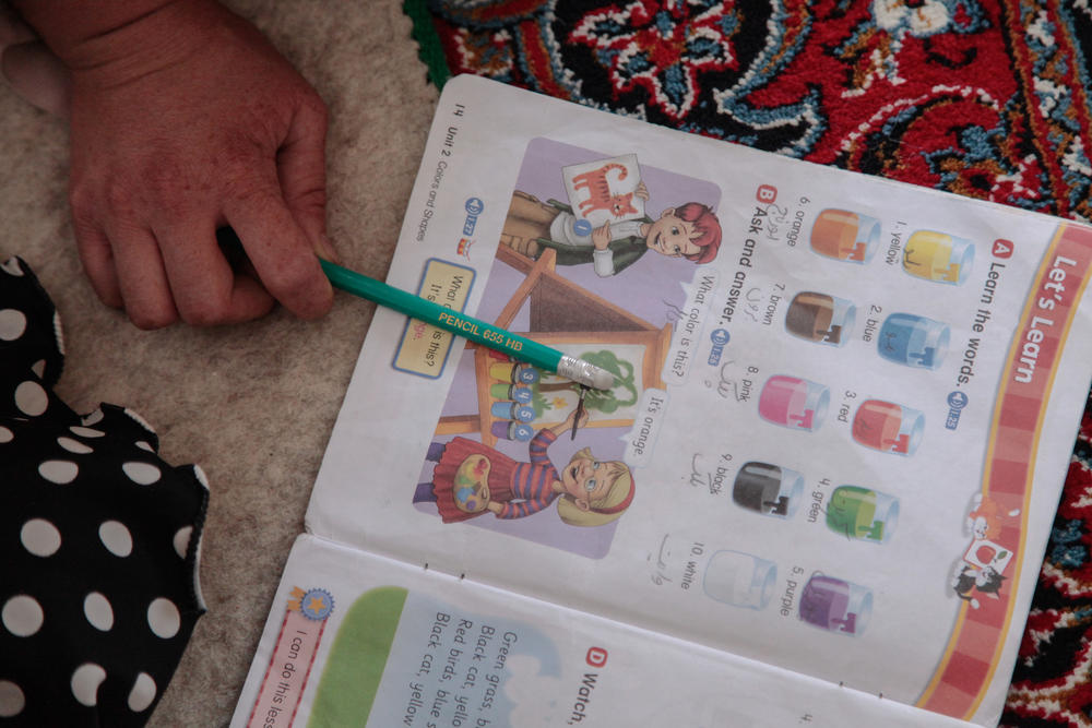 A teenage girl revises the words for different colors in an English class held in a small secret school on the outskirts of Kabul. The school was established inside a home in a working class area of Kabul after the Taliban reneged on a promise in late March to allow girls to attend secondary school.