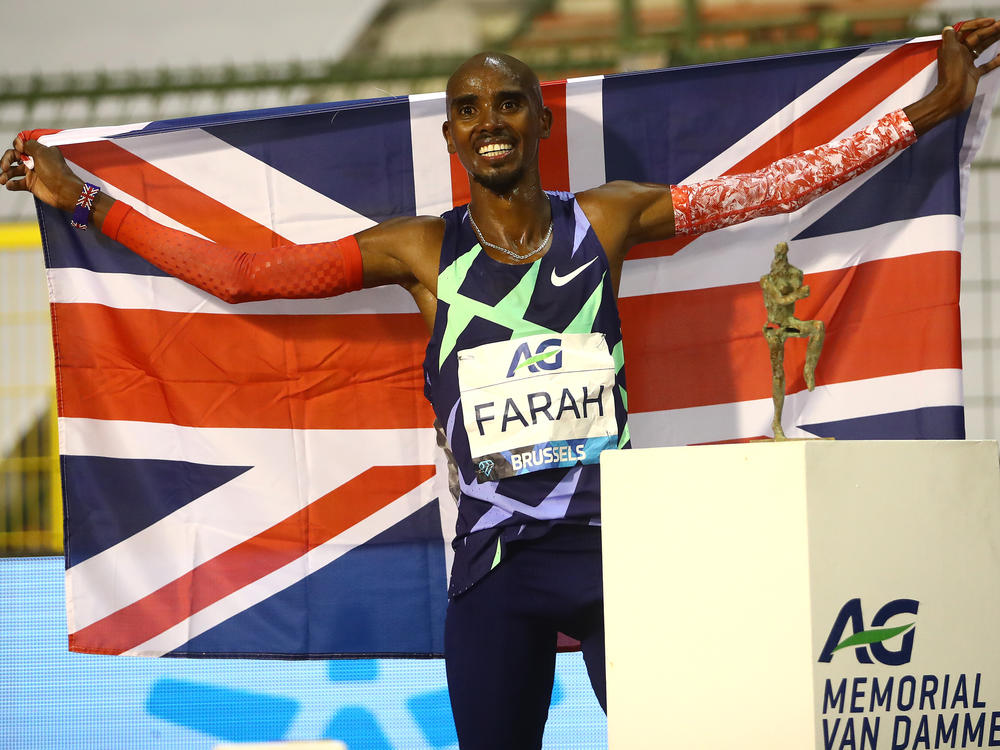 Mo Farah is one of the world's most successful track athletes, but he says he was first brought to the U.K. and forced to work as a child servant. He's seen here celebrating winning the One Hour Race at the Memorial Van Damme Brussels 2020 Diamond League meeting in Belgium.