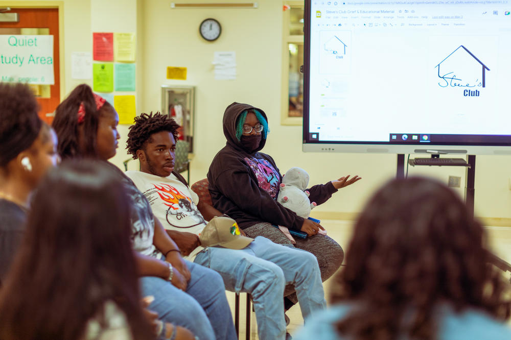 Students share their experiences during a group session at Steve's Club. 