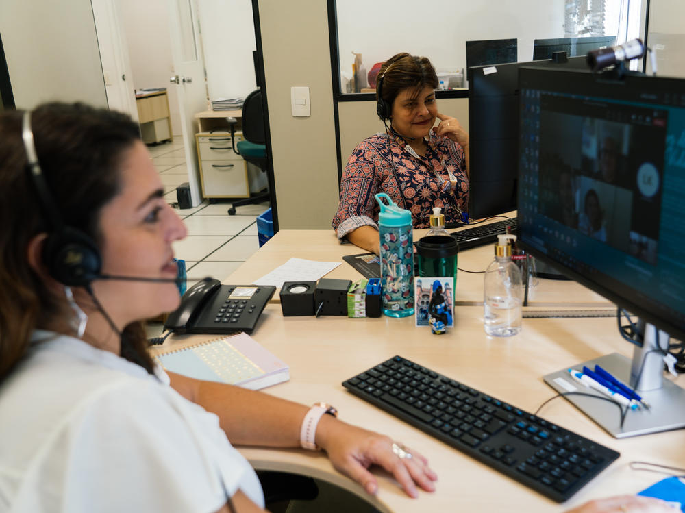 Scientists Ana Paula Ano Bom (left) and Patricia Neves share an office that's barely big enough for two desks. Their institute is a public entity in Brazil with nowhere near the funding available to private pharmaceutical companies in wealthy countries.