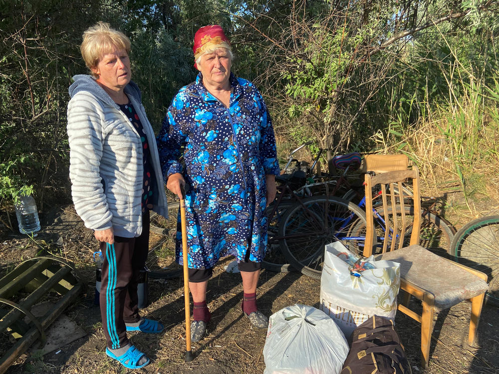Inna Kravchenko, 52, and her mother, Raïsa Kozlova, 75, moments after crossing by bike from Russian-occupied territory in the Kherson region to the Ukrainian-controlled village of Zelenodolsk. They were able to bring three bags of belongings but fear their house they left behind will be destroyed by Russian soldiers.