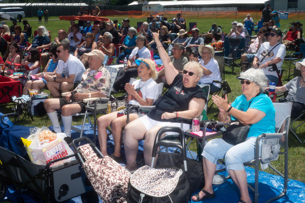 Cindy Resovsky of Taylor, Mich., cheers for Matt King as he takes the stage at the Michigan Elvisfest on Saturday, July 9.