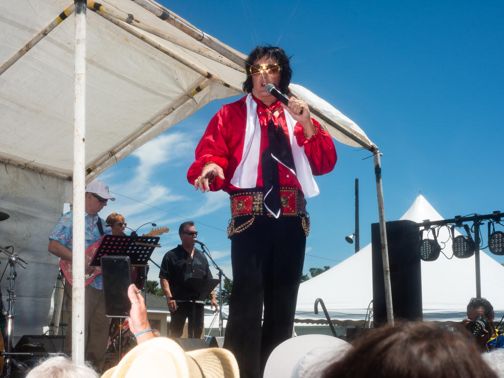 Matt King performs onstage at the Michigan Elvisfest in Belleville, Mich., on Saturday, July 9. King has been performing as Elvis for 30 years; his first performance was when he was 14.