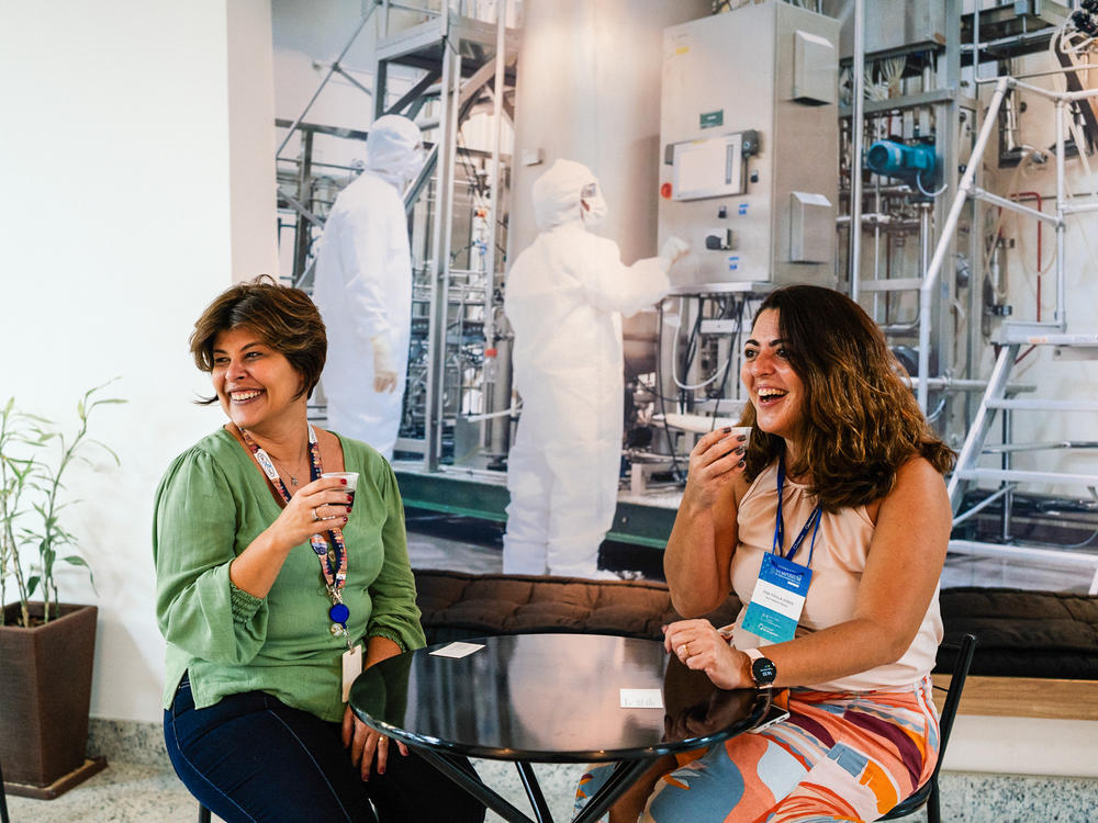 Patricia Neves (left) and Ana Paula Ano Bom take a break at the institute in Rio de Janeiro where they work. The two scientists say they've been inseparable since they met in college. Now their friendship has made it possible to launch a remarkable partnership to make mRNA vaccines accessible to the world.