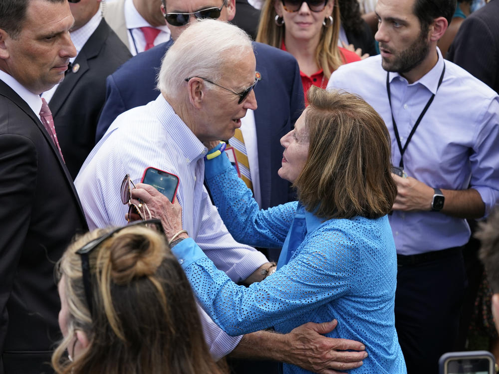 President Biden greets House Speaker Nancy Pelosi at the White House Congressional Picnic, held just before he left for Israel on Tuesday.