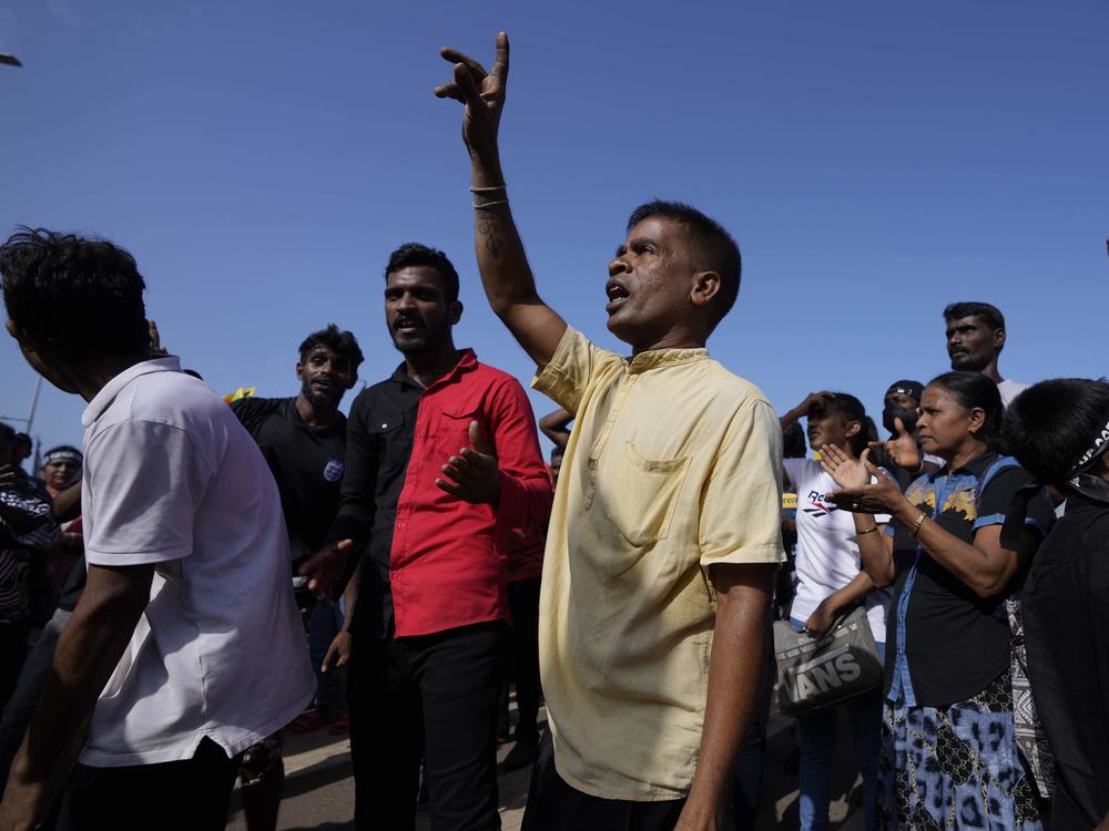 Protesters dance shouting slogans against president Gotabaya Rajapaksa outside his office in Colombo, Sri Lanka, Wednesday, July 13, 2022.