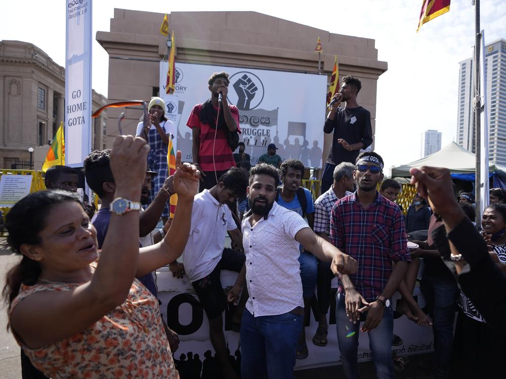 Protesters dance shouting slogans against president Gotabaya Rajapaksa outside his office in Colombo, Sri Lanka on Wednesday. The president of Sri Lanka fled the country early Wednesday, slipping away in the middle of the night only hours before he was to step down amid a devastating economic crisis that has triggered severe shortages of food and fuel.