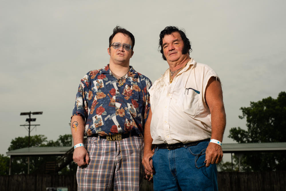 Tim Jones and his son Jeremiah Johnson of Defiance, Ohio, pose at the Michigan Elvisfest on Friday, July 8.