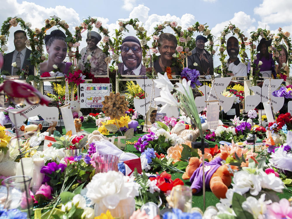 The white gunman who killed 10 Black people and injured three other individuals at a Tops supermarket in Buffalo, N.Y., in May was indicted by a federal grand jury on Thursday on hate crimes and firearm charges. Here, a memorial for the supermarket shooting victims is set up outside Tops on July 14.
