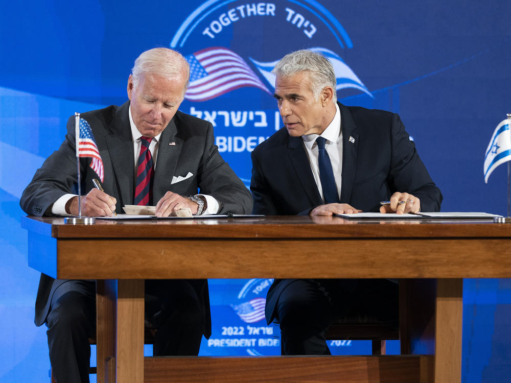 President Biden and Israeli Prime Minister Yair Lapid sign a joint declaration on Israeli security before giving a press conference in Jerusalem.