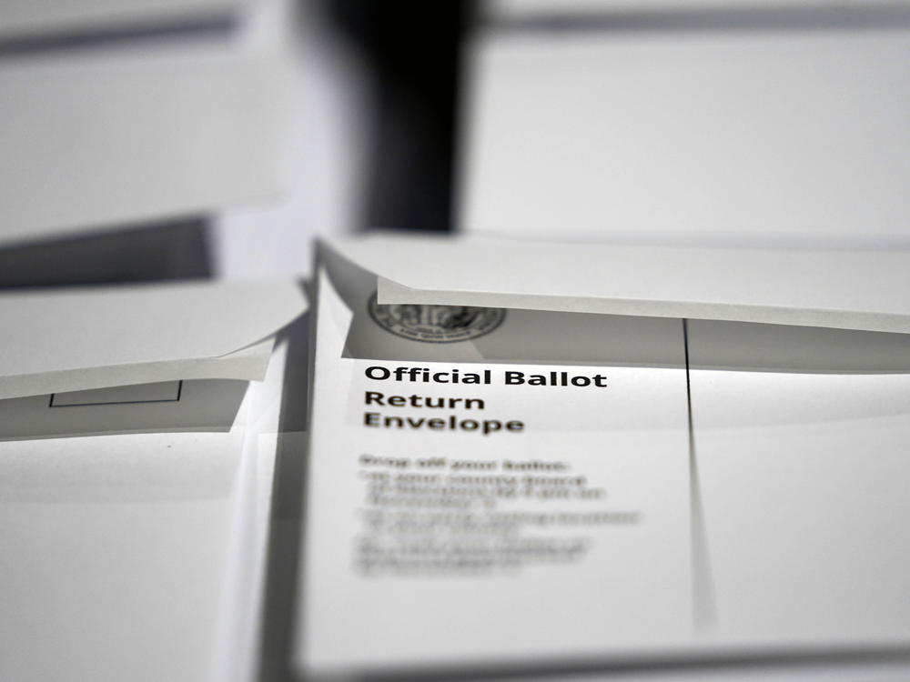 Stacks of ballot envelopes waiting to be mailed are seen at the Wake County Board of Elections on Sept. 3, 2020, in Raleigh, N.C. The Green Party has so far been kept off North Carolina's 2022 Senate ballot by the Democratic-led Board of Elections.