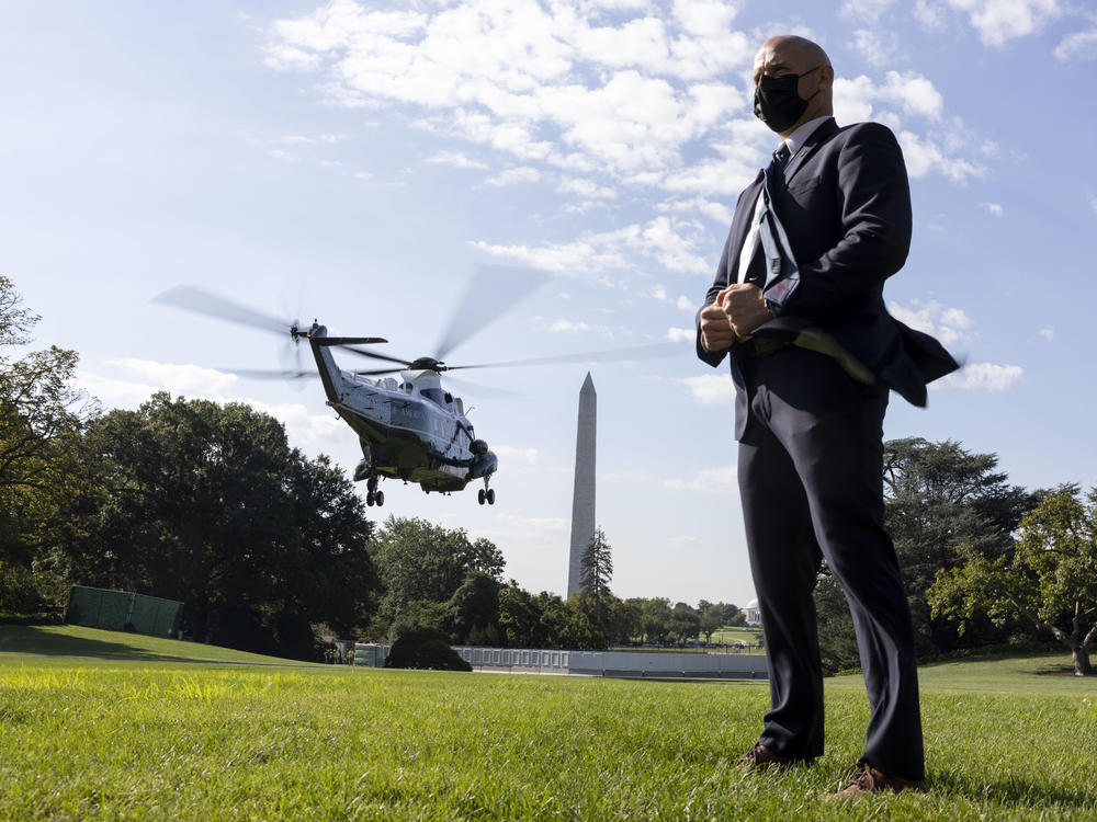 A U.S. Secret Service agent stands by as Marine One departs with President Biden aboard as he departs the White House in September 2021.