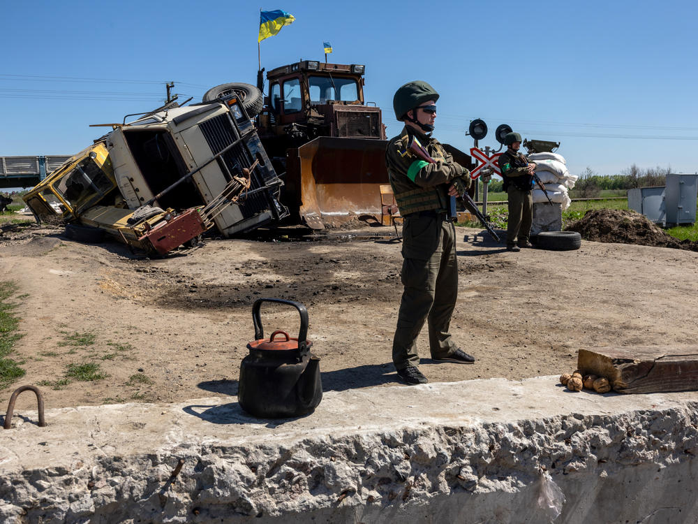 Ukrainian national guard soldiers stand watch near front-line positions on May 7 in Zelenodolsk, Ukraine. The area is on the northern edge of the Kherson region, much of which came under Russian control early in the war.