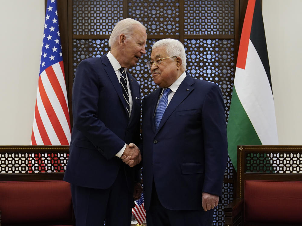 President Biden shakes hands with Palestinian President Mahmoud Abbas after they met in the West Bank town of Bethlehem.