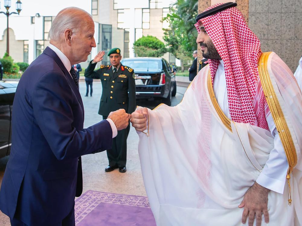 In this photo released by the Saudi Press Agency, Saudi Crown Prince Mohammed bin Salman and President Biden bump fists as they begin meetings in Jeddah.