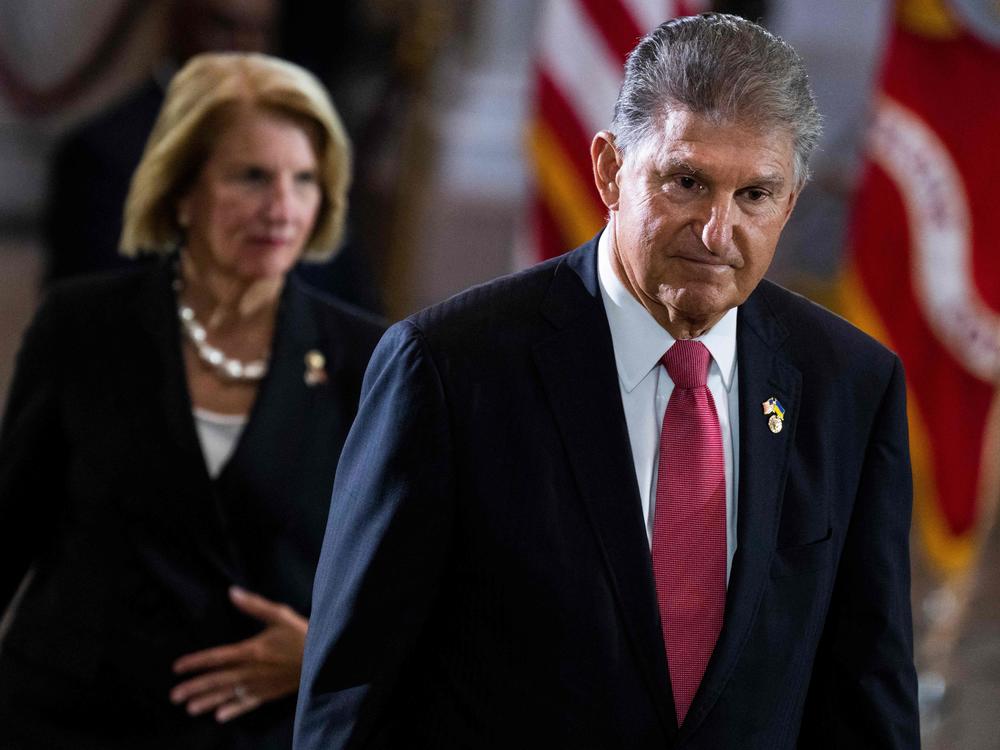 US Sen. Joe Manchin (D-WV)  pays respects to US Marine Corp Chief Warrant Officer 4, Hershel Woodrow Woody Williams, laying in honor at the Rotunda of the US Capitol in Washington, DC, on July 14, 2022.