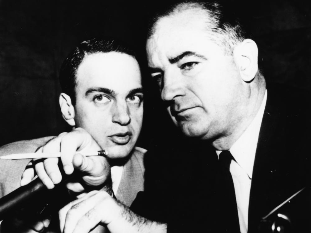 Attorney Roy Cohn, left, confers with red-hunting Sen. Joseph McCarthy, R-Wisc., during Senate hearings in 1954.