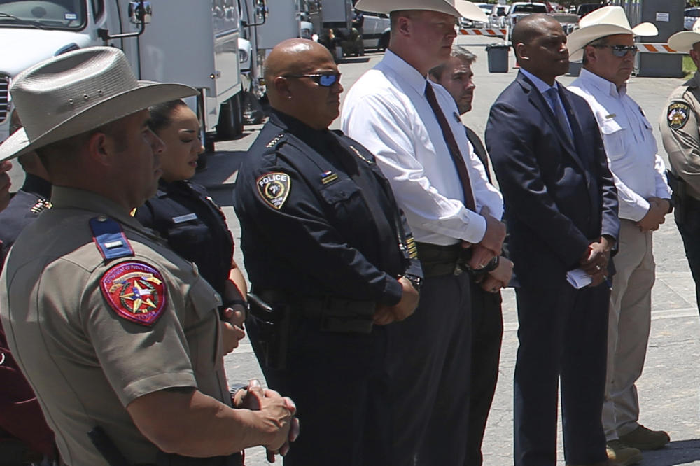 Uvalde School Police Chief Pete Arredondo, third from left, stands during a news conference outside of the Robb Elementary school in Uvalde, Texas Thursday, May 26, 2022.