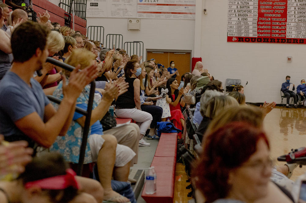 A crowd cheers on the dancers at Dance Mobility's Adapted Ballroom Dance Competition at the Roeper School in Bloomfield Hills, Mich., earlier this month.