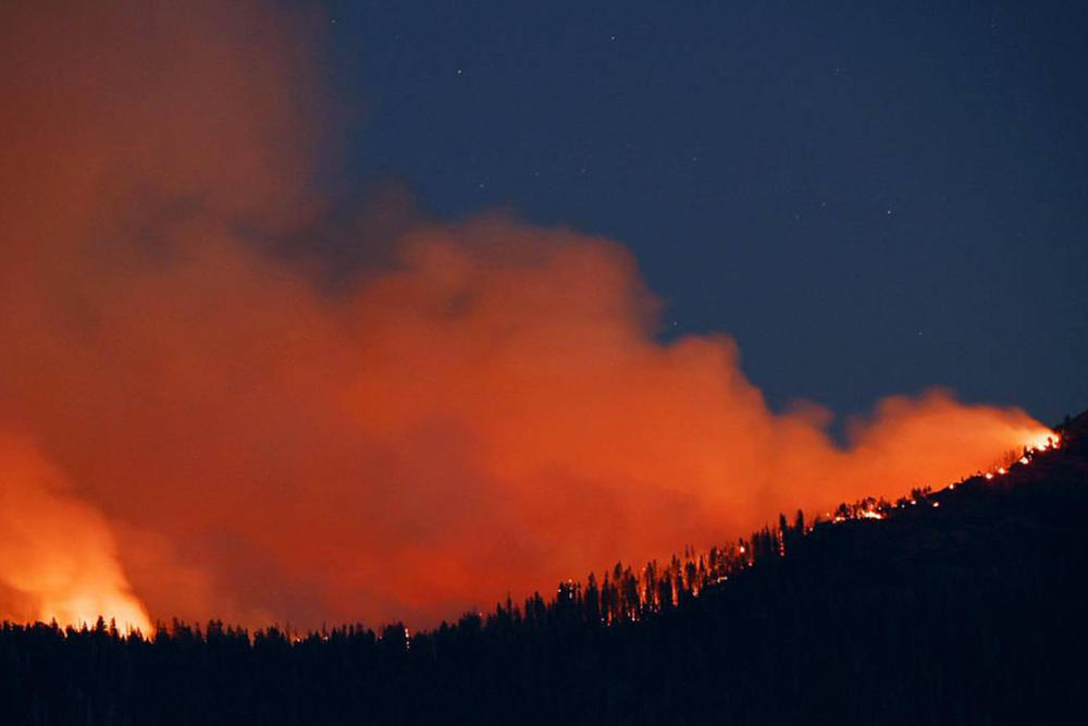 The Washburn Fire burns near the south entrance of Yosemite National Park on July 11 near Oakhurst, Calif.
