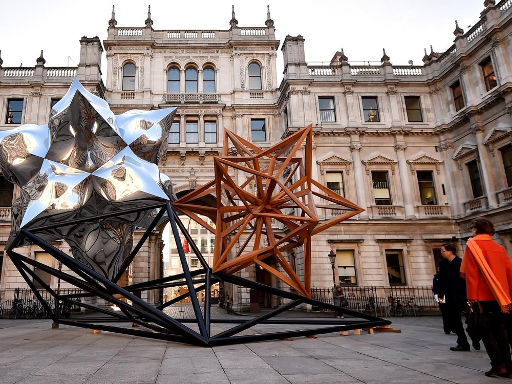 A 2014 sculpture by Frank Stella entitled <em>Inflated Star and Wooden Star</em> in the courtyard at the Royal Academy of Arts on Feb. 18, 2015, in London.