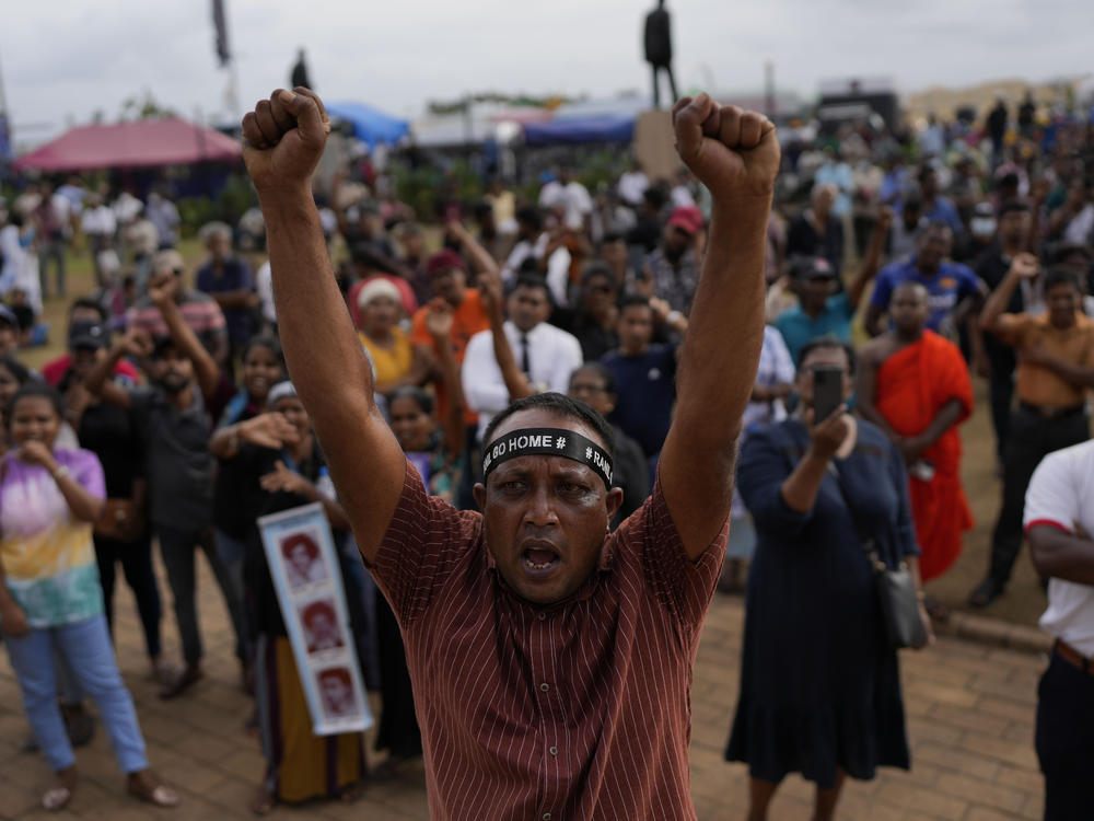 Protesters shout slogans demanding elected president Ranil Wickremesinghe step down on Wednesday.